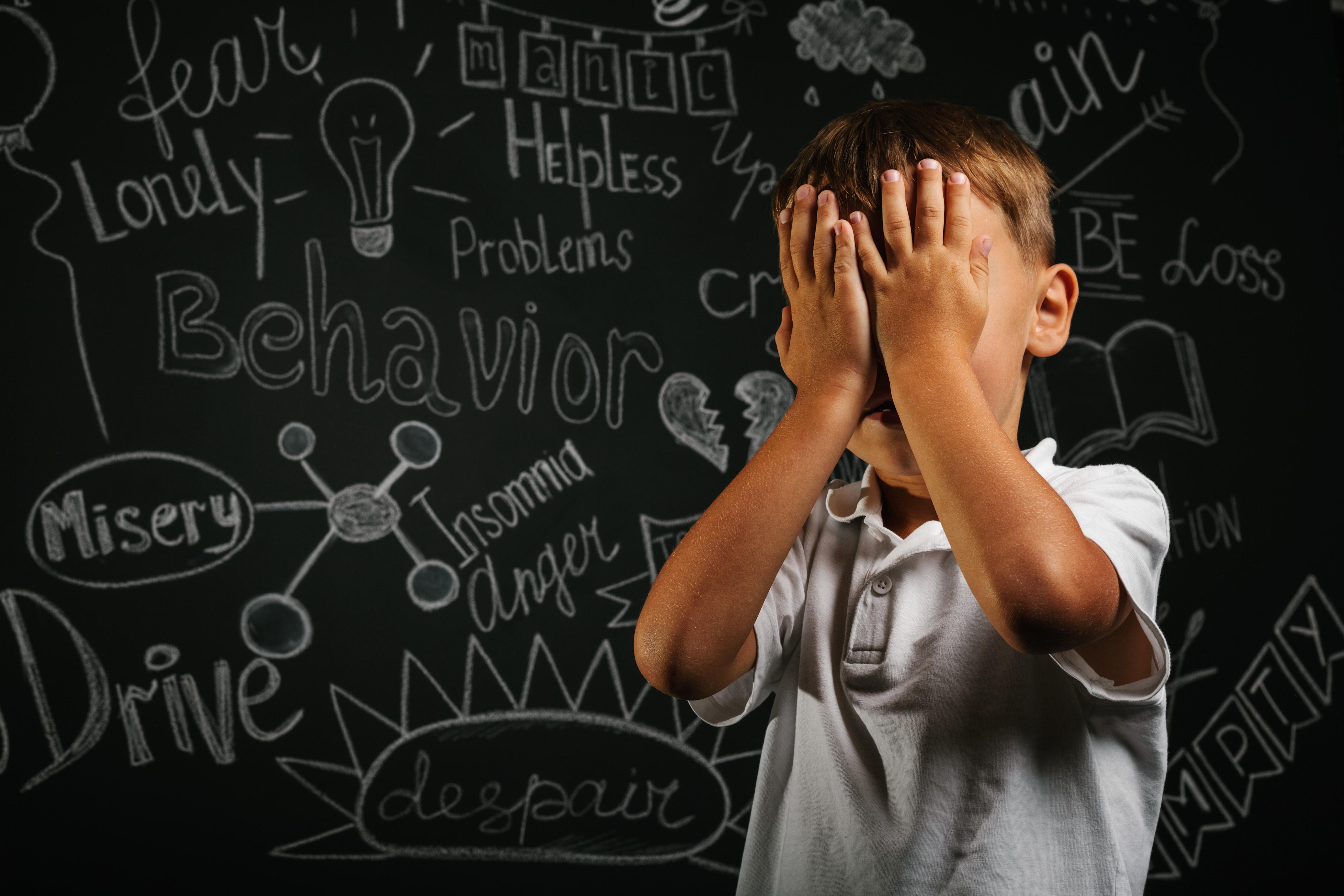child-whose-depression-is-black-background-with-his-hands-closed